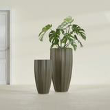 San Jose Tall Fluted fiberglass planter in Matte Bronze, size range, in a sunlit interior