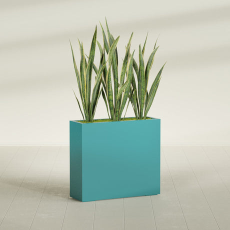Delray Rectangular fiberglass planter in Satin Seafoam Green, shown planted, in a sunlit interior