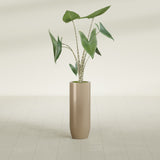 Saint Tropez Bullet Round fiberglass planter in Gloss Metallic Gold, shown planted, in a sunlit interior