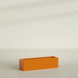 Monaco Rectangle Planter in Gloss Tangerine, 26"L, shown empty