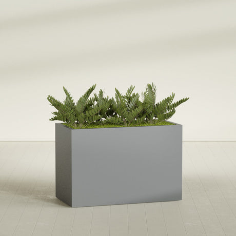 Brisbane Corner fiberglass planter in Matte Gunmetal, shown planted, in a sunlit interior