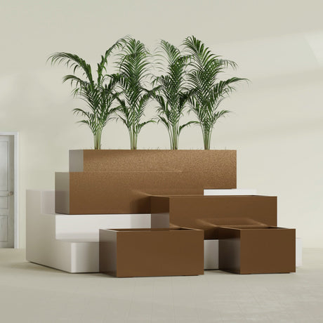 Torino Corner fiberglass planter in Metallic Bronze, size range, in a sunlit interior