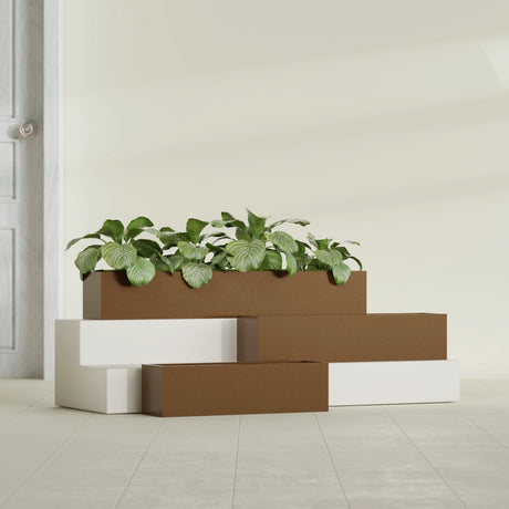 Monaco Rectangle fiberglass planter in Metallic Bronze, shown planted, in a sunlit interior
