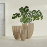 Alicante Fluted fiberglass planter in Gloss Metallic Gold, size range, in a sunlit interior