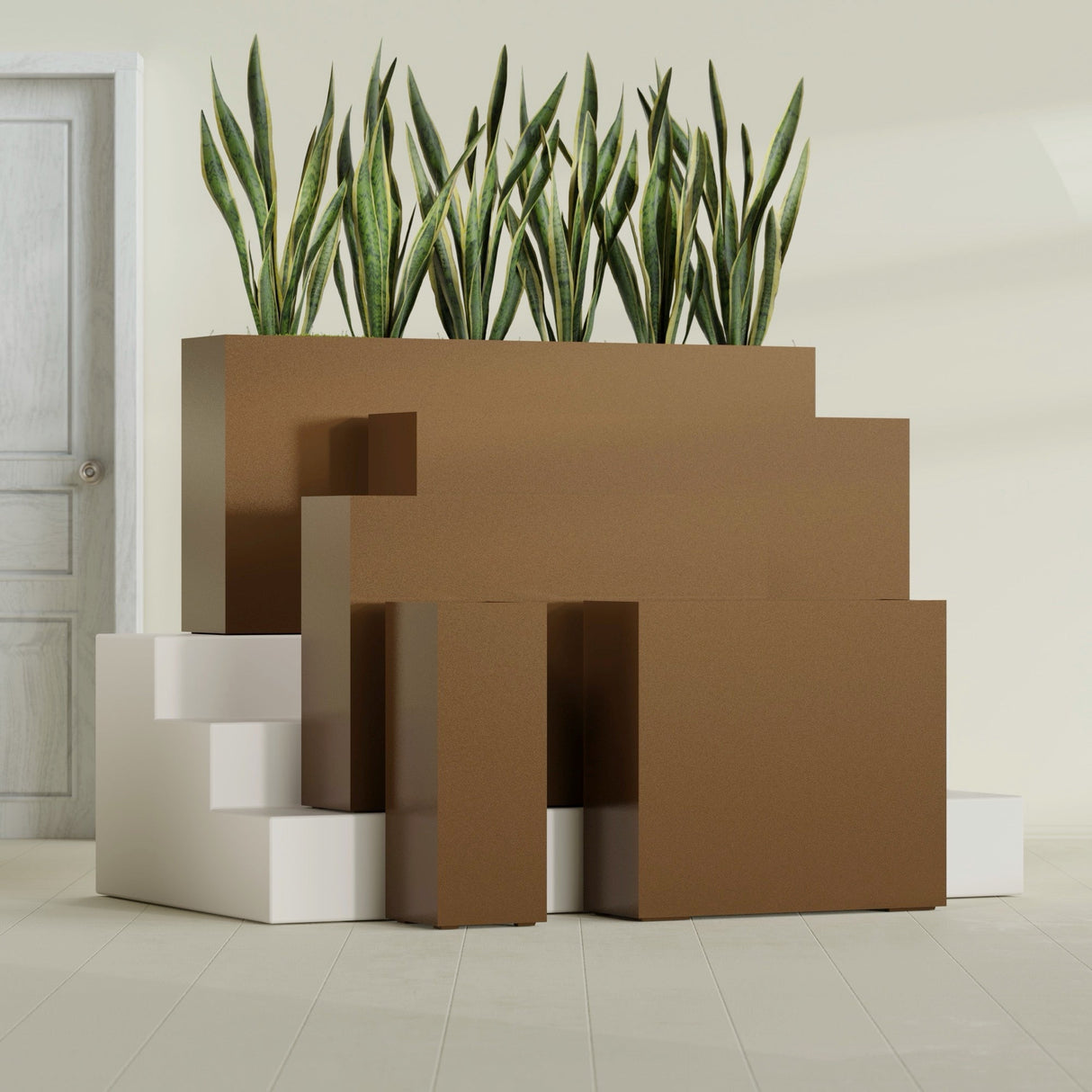 Delray Corner fiberglass planter in Metallic Bronze, size range, in a sunlit interior