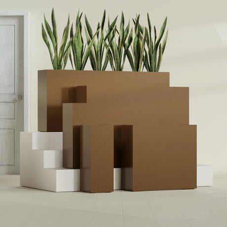 Delray Corner fiberglass planter in Metallic Bronze, size range, in a sunlit interior