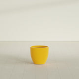 Wannsee Round Planter in Gloss Saffron, 22"D × 19"H, shown empty