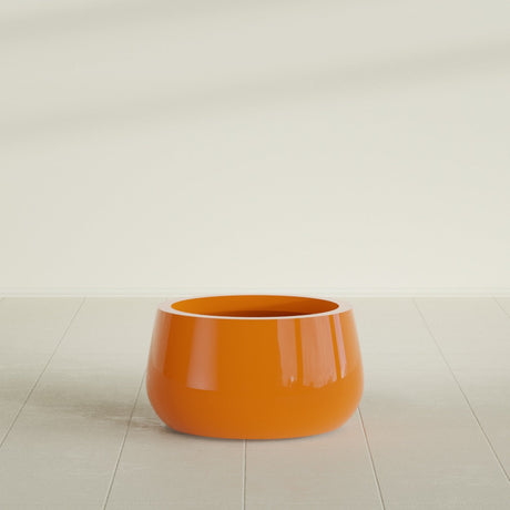 Short Hayden Bowl Planter in Gloss Tangerine, 16"D × 8"H, shown empty