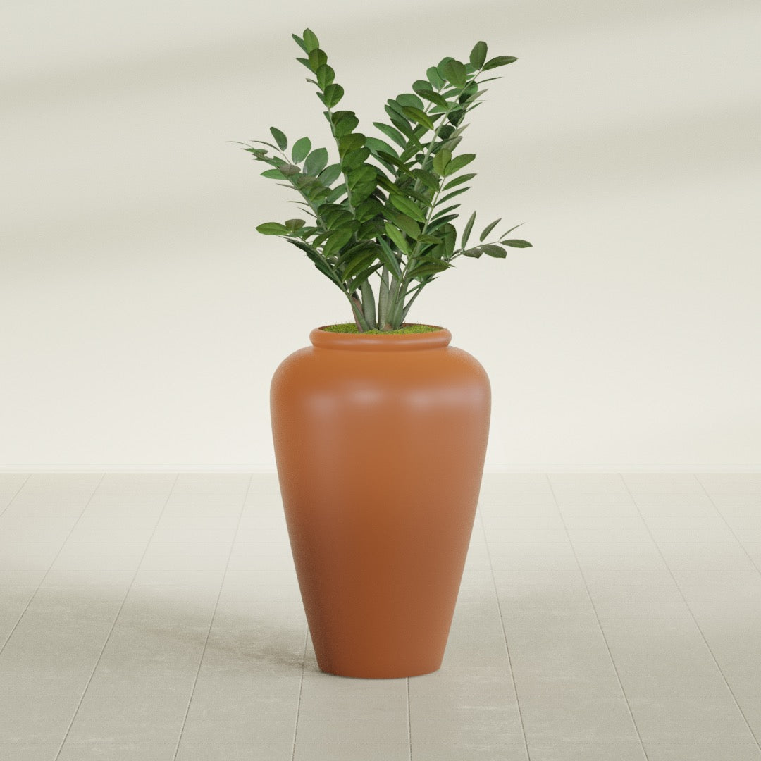 Barà Jar fiberglass planter in Matte Terra Cotta, shown planted, in a sunlit interior