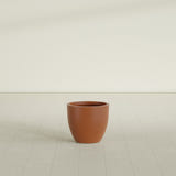 Wannsee Round Planter in Matte Terra Cotta, 22"D × 19"H, shown empty