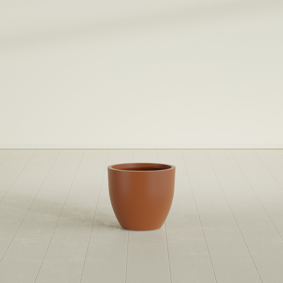 Wannsee Round Planter in Matte Terra Cotta, 22"D × 19"H, shown empty
