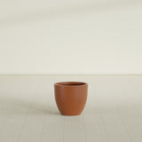 Wannsee Round Planter in Matte Terra Cotta, 22"D × 19"H, shown empty