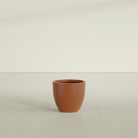 Wannsee Round Planter in Matte Terra Cotta, 22"D × 19"H, shown empty
