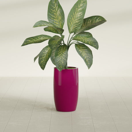 Lisbon Tall Round fiberglass planter in Gloss Eggplant, shown planted, in a sunlit interior
