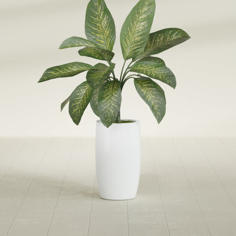 Lisbon Tall Round fiberglass planter in Matte Bright White, shown planted, in a sunlit interior