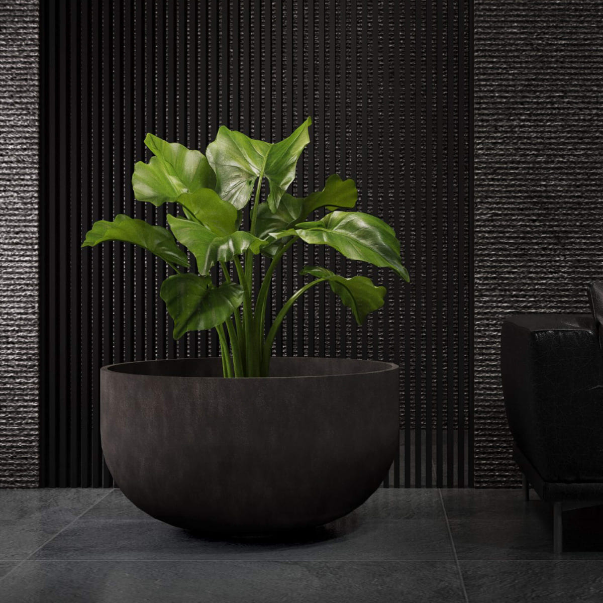 Roco low round Cosapots fiberglass planter, shown planted in an interior setting.