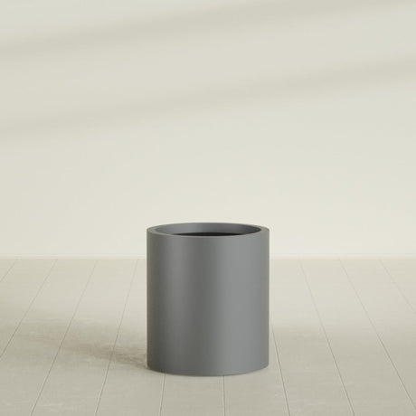 Rio Grande Cylinder Planter in Matte Gunmetal, 18"D × 20"H, shown empty
