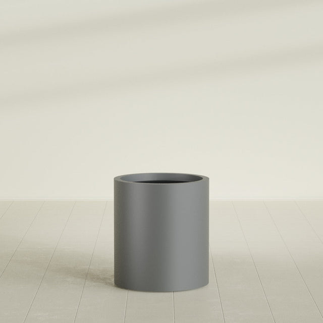 Rio Grande Cylinder Planter in Matte Gunmetal, 18"D × 20"H, shown empty
