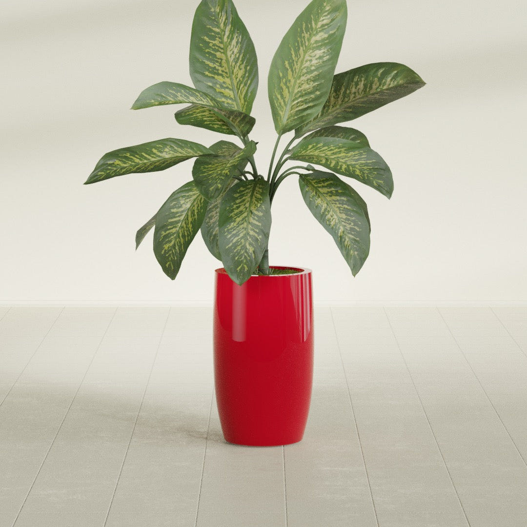 Lisbon Tall Round fiberglass planter in Gloss Red, shown planted, in a sunlit interior