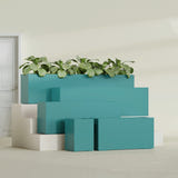 Miami Narrow Rectangular fiberglass planter in Satin Seafoam Green, size range, in a sunlit interior