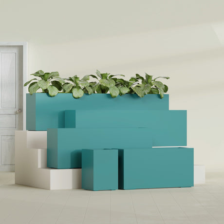 Miami Corner fiberglass planter in Satin Seafoam Green, size range, in a sunlit interior