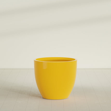 Wannsee Round Planter in Gloss Saffron, 44"D × 39"H, shown empty