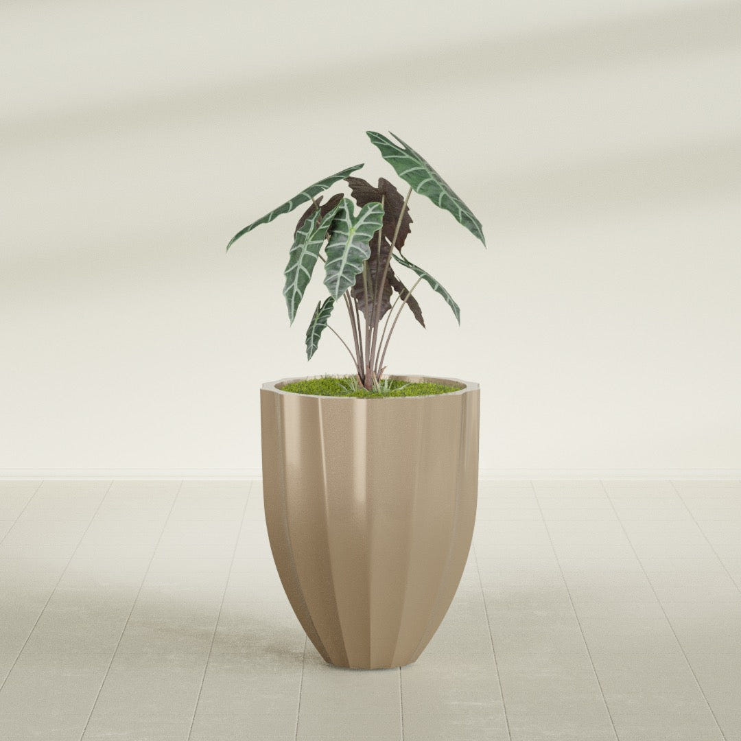 Alicante Fluted fiberglass planter in Gloss Metallic Gold, shown planted, in a sunlit interior