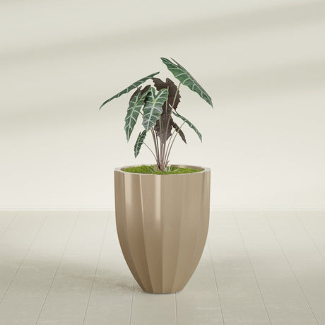 Alicante Fluted fiberglass planter in Gloss Metallic Gold, shown planted, in a sunlit interior