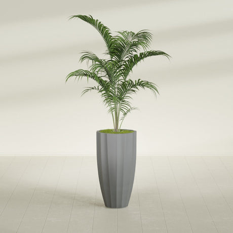 San Jose Tall Fluted fiberglass planter in Matte Gunmetal, shown planted, in a sunlit interior