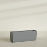 Panama Tapered Rectangular Planter in Matte Gunmetal, 48"L × 12"D × 18"H, shown empty