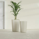 Tegel Round Tapered fiberglass planter in Satin Beige, size range, in a sunlit interior