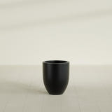 Valencia Tapered Round Planter in Matte Black, 15"D × 18"H, shown empty