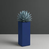 Delray Corner fiberglass planter in Matte Cobalt Blue, planted with blue-grey agave, studio