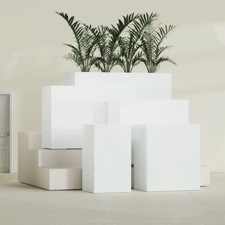 Darwin Corner fiberglass planter in Gloss Bright White, size range, in a sunlit interior