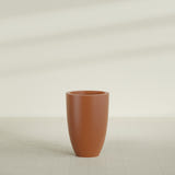 Brannan Tapered Round Planter in Matte Terra Cotta, 24"D × 35"H, shown empty