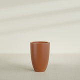Brannan Tapered Round Planter in Matte Terra Cotta, 24"D × 35"H, shown empty