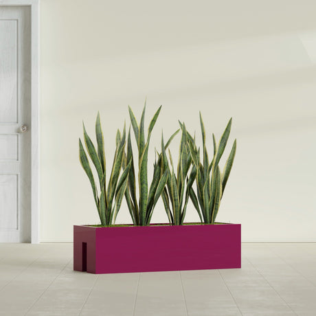 Tiergarden Railing fiberglass planter in Gloss Eggplant, shown planted, in a sunlit interior