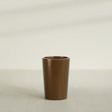 Tegel Round Tapered Planter in Metallic Bronze, 18"D × 26"H, shown empty