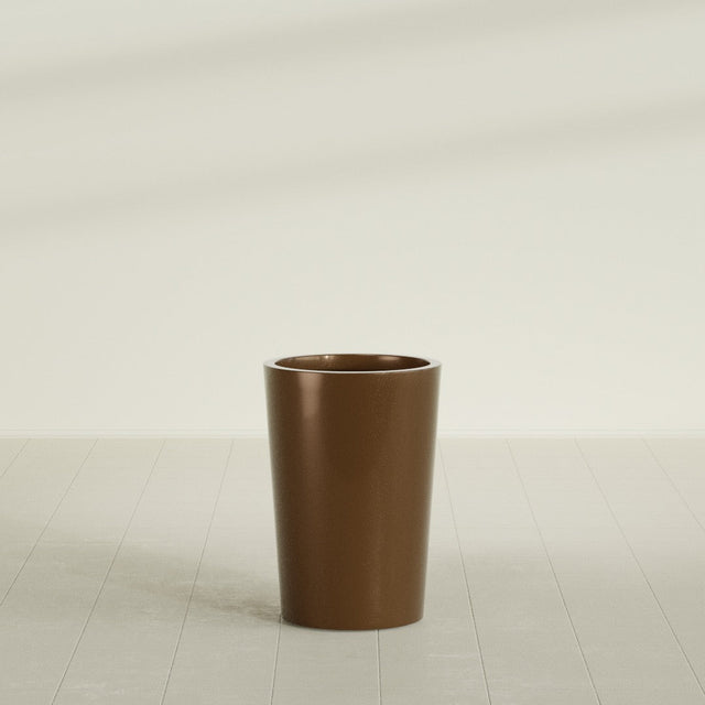 Tegel Round Tapered Planter in Metallic Bronze, 18"D × 26"H, shown empty