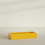 Antwerp Rectangular Planter in Gloss Saffron, 60"L × 24"D × 12"H, shown empty