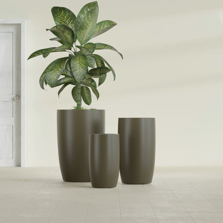 Lisbon Tall Round fiberglass planter in Matte Bronze, size range, in a sunlit interior