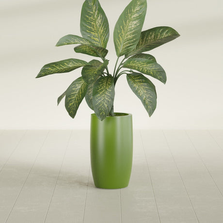 Lisbon Tall Round fiberglass planter in Satin Green, shown planted, in a sunlit interior