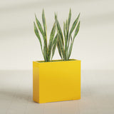 Perth Corner fiberglass planter in Gloss Saffron, shown planted, in a sunlit interior