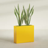 Perth Rectangular fiberglass planter in Gloss Saffron, shown planted, in a sunlit interior