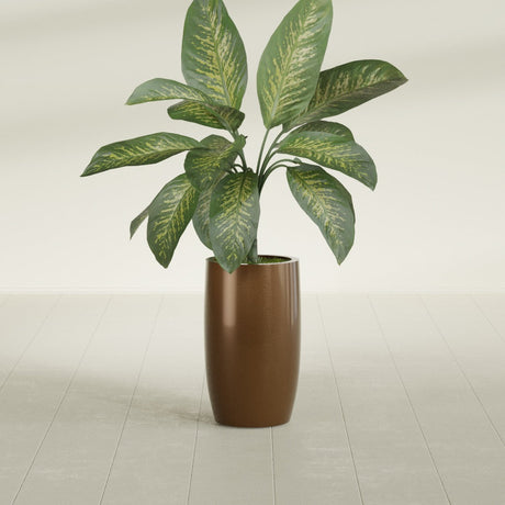 Lisbon Tall Round fiberglass planter in Metallic Bronze, shown planted, in a sunlit interior