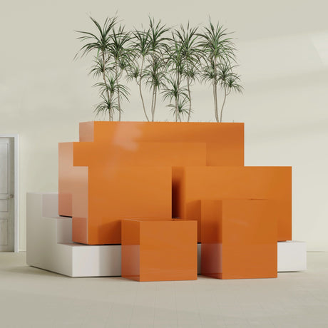 Brisbane Corner fiberglass planter in Gloss Tangerine, size range, in a sunlit interior