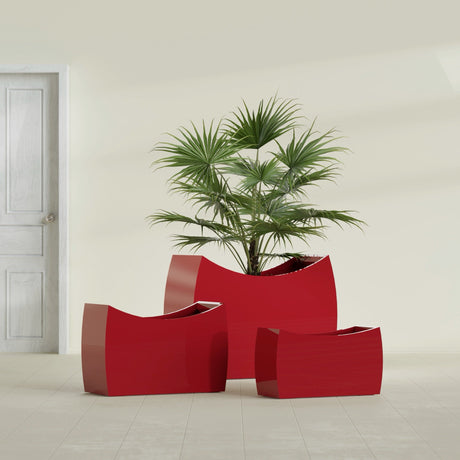 Seoul Curved fiberglass planter in Gloss Red, size range, in a sunlit interior