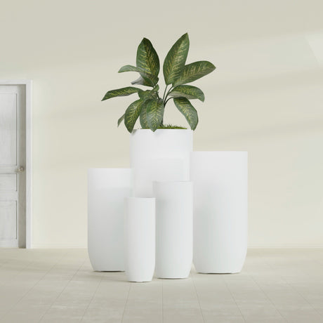 Saint Tropez Bullet Round fiberglass planter in Matte Bright White, size range, in a sunlit interior