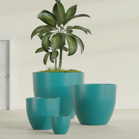 Wannsee Round fiberglass planter in Satin Seafoam Green, size range, in a sunlit interior