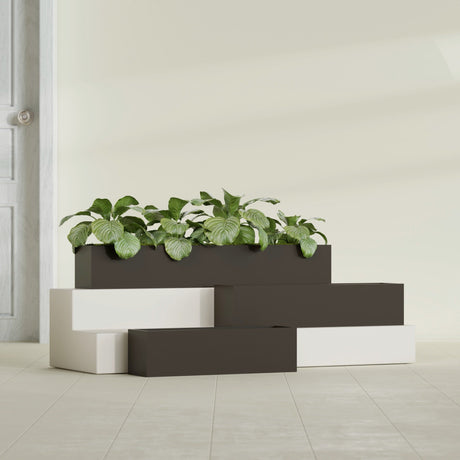Monaco Rectangle fiberglass planter in Matte Dark Brown, shown planted, in a sunlit interior